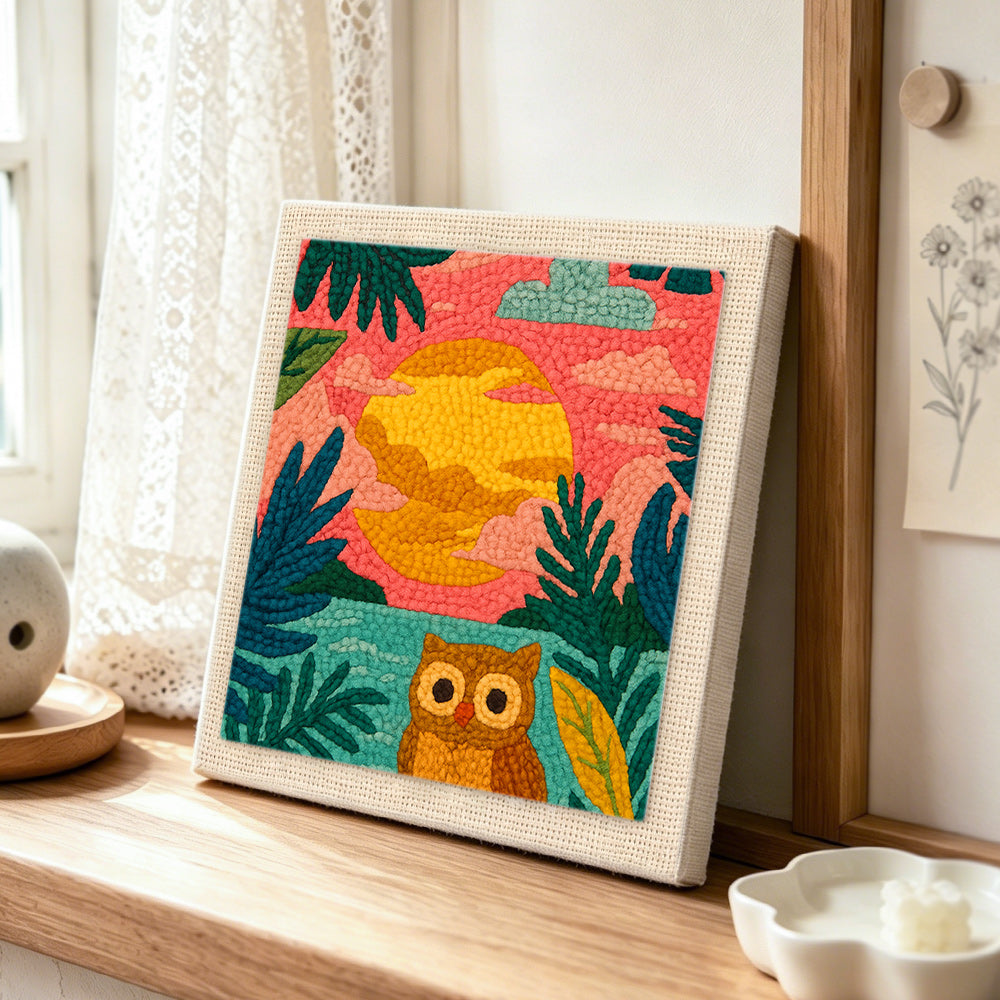 Colourful jungle sunset with owl punch needle artwork displayed on a table