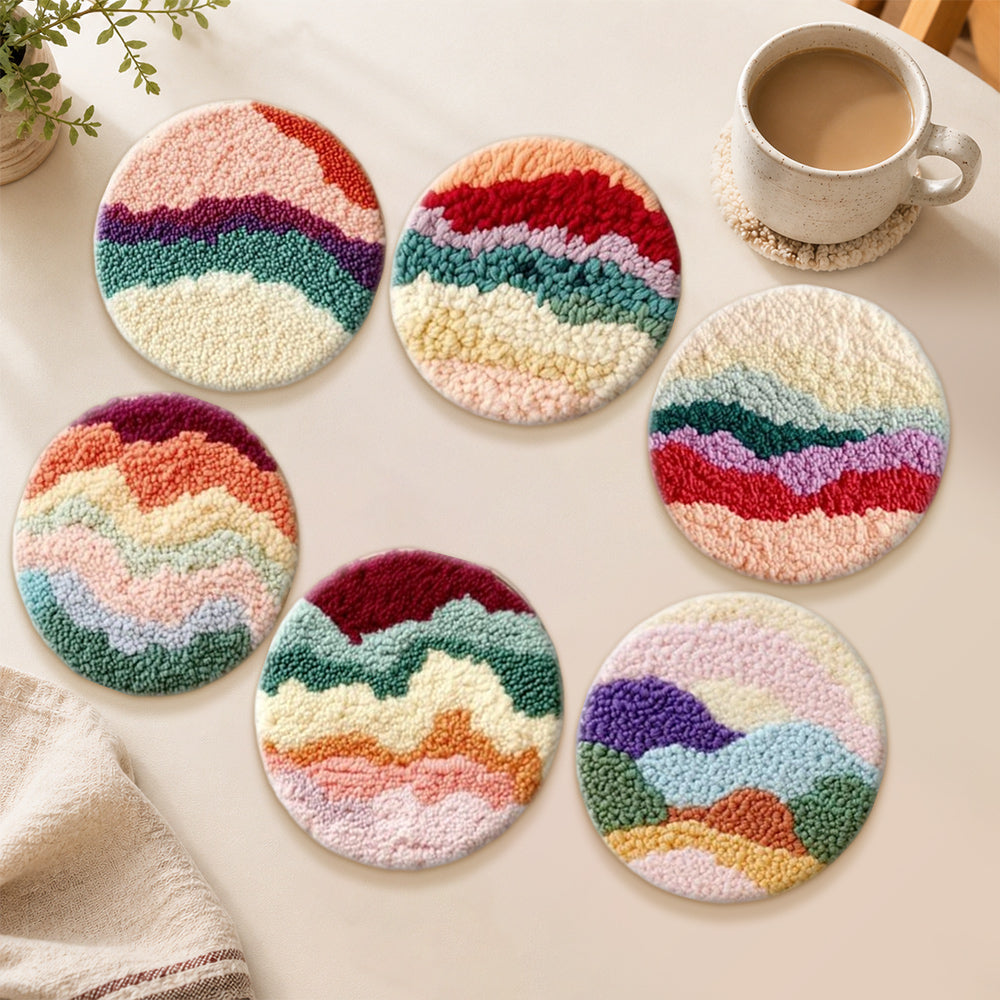 Colourful layered landscape punch needle coasters used for home decoration