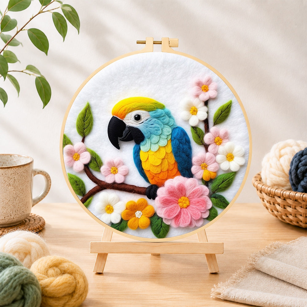 Finished colourful macaw parrot with flowers needle felting displayed on a wooden easel