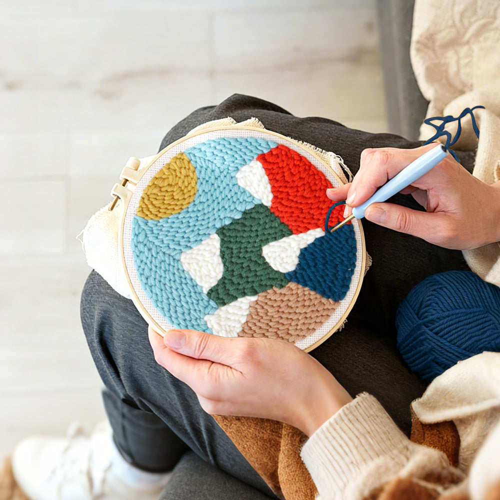 Creating handmade colourful mountain landscape punch needle artwork