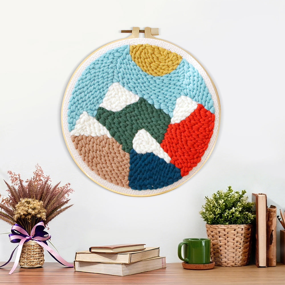 Finished colourful mountain landscape artwork displayed on a wall