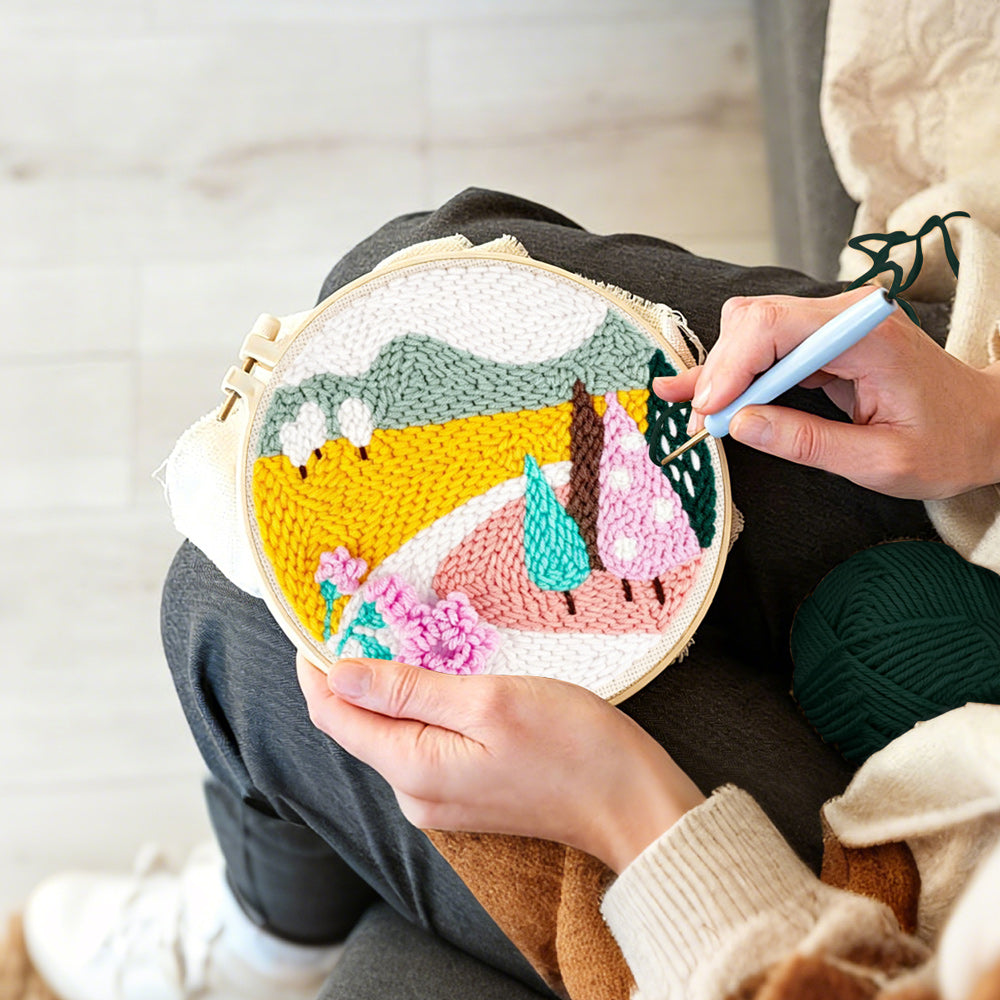 Creating handmade colourful mountains and trees punch needle artwork