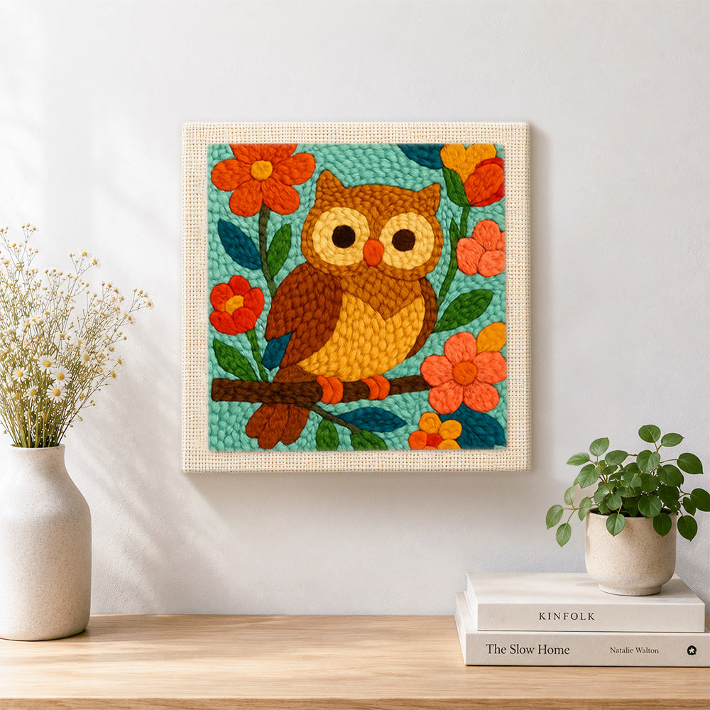 Finished colourful owl on flowering branch artwork displayed on a wall