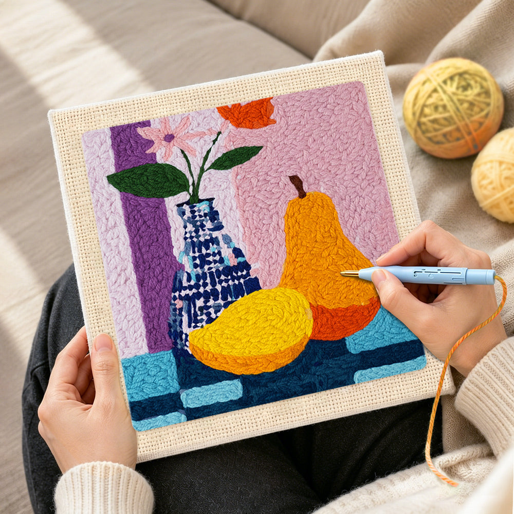 Creating handmade colourful pear and vase still life punch needle artwork