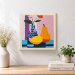 Finished colourful pear and vase still life artwork displayed on a wall