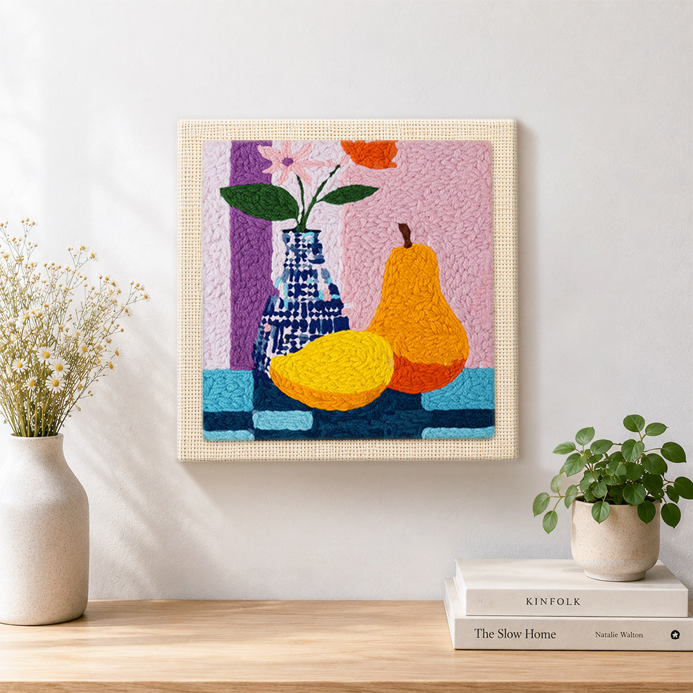 Finished colourful pear and vase still life artwork displayed on a wall