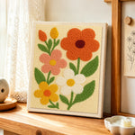 Colourful petal flowers punch needle artwork displayed on a table