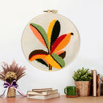 Finished colourful radial leaves artwork displayed on a wall