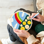 Creating handmade colourful rainbow with yellow roses punch needle artwork
