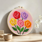 Colourful rose bouquet punch needle artwork displayed on a table