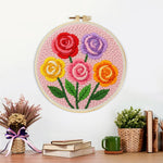 Finished colourful rose bouquet artwork displayed on a wall