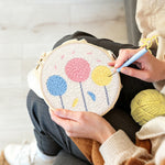 Creating handmade colourful round flowers punch needle artwork