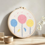 Colourful round flowers punch needle artwork displayed on a table