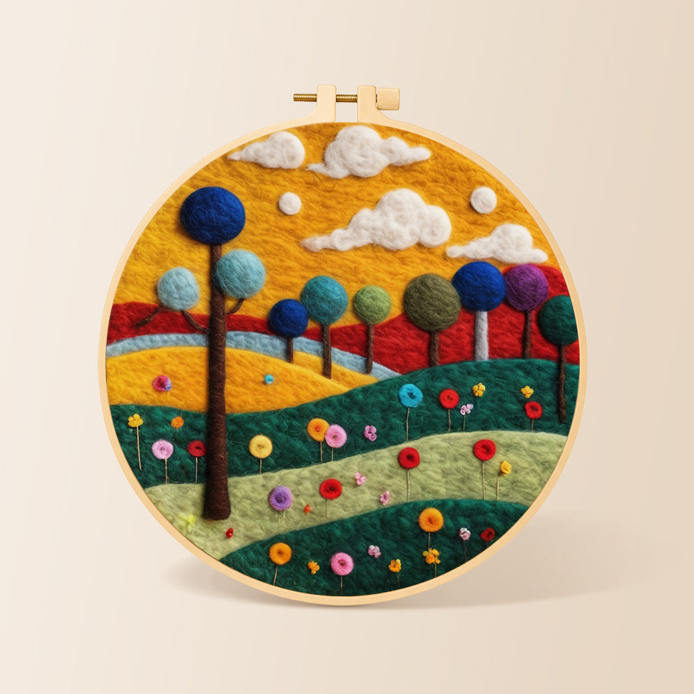 Colourful round trees on whimsical hills needle felting kit for beginners with a round wooden frame