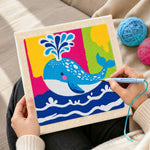 Creating handmade colourful spouting whale punch needle artwork