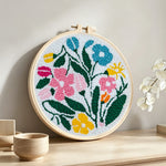 Colourful summer blooms punch needle artwork displayed on a table