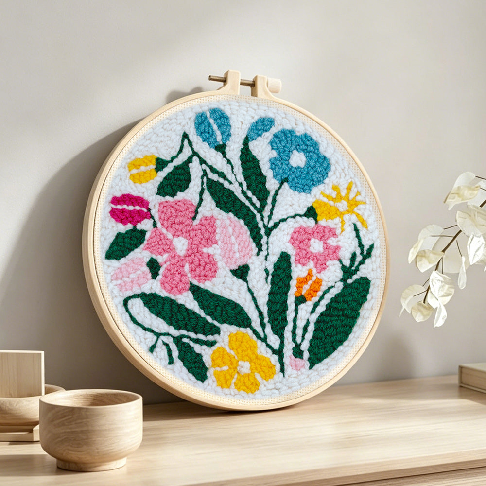 Colourful summer blooms punch needle artwork displayed on a table