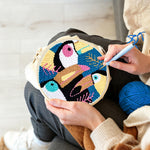 Creating handmade colourful tropical toucan punch needle artwork
