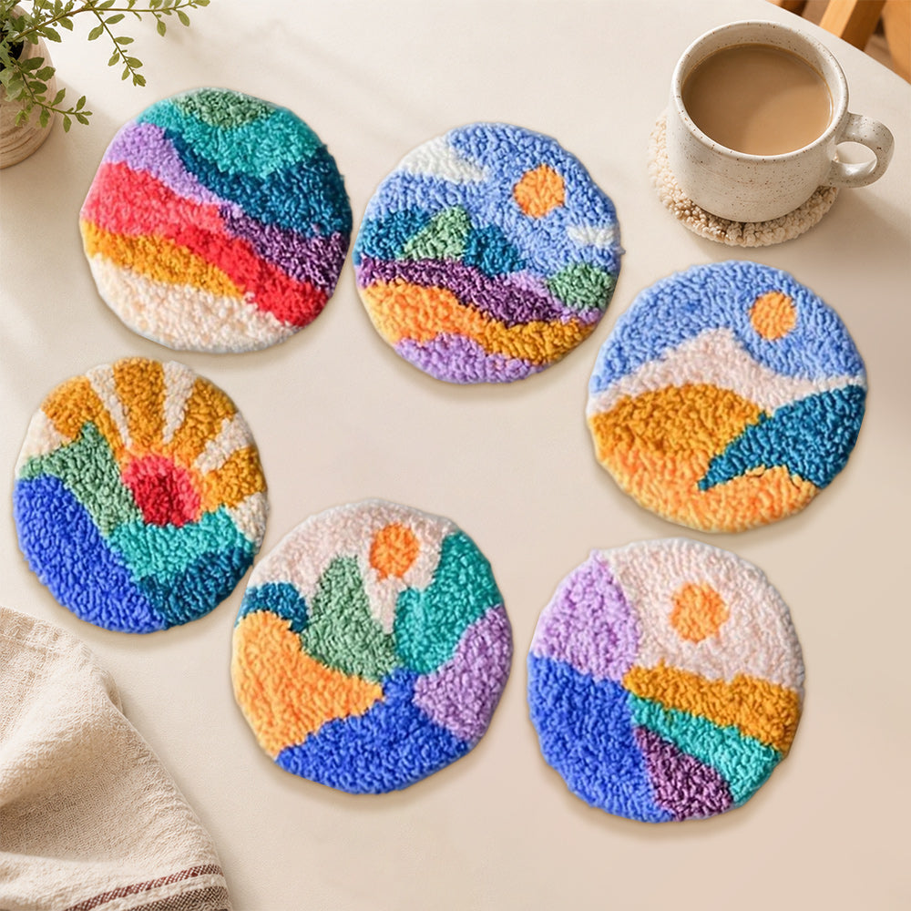 Colourful valley and sunrise punch needle coasters used for home decoration
