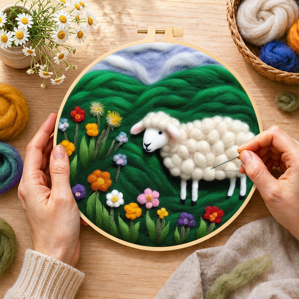 Creating the colourful wildflower meadow with a sheep wool painting by hand with a felting needle