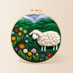 Colourful wildflower meadow with a sheep needle felting kit for beginners with a round wooden frame