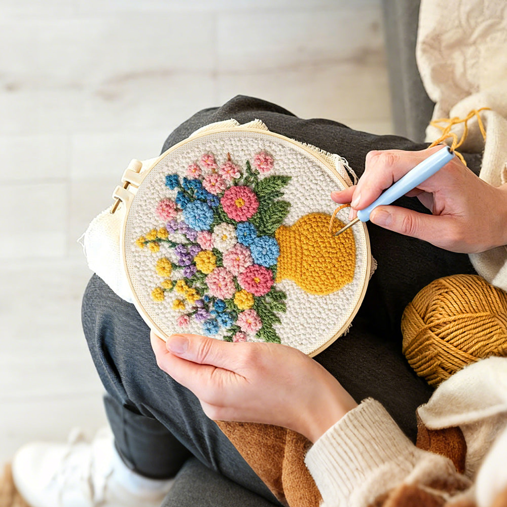 Creating handmade colourful wildflowers in yellow vase punch needle artwork