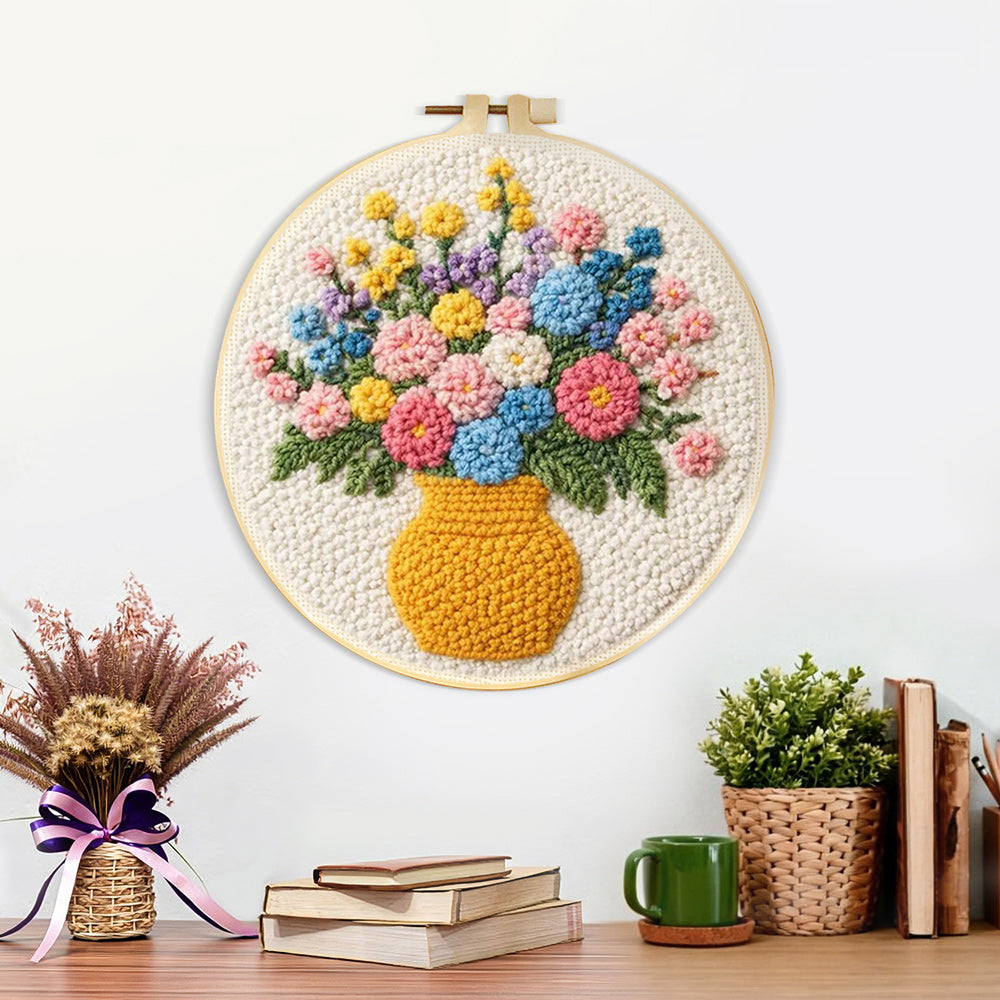 Finished colourful wildflowers in yellow vase artwork displayed on a wall