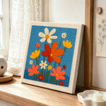 Colourful wildflowers punch needle artwork displayed on a table