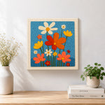 Finished colourful wildflowers artwork displayed on a wall
