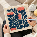 Creating handmade coral and navy flowers punch needle artwork