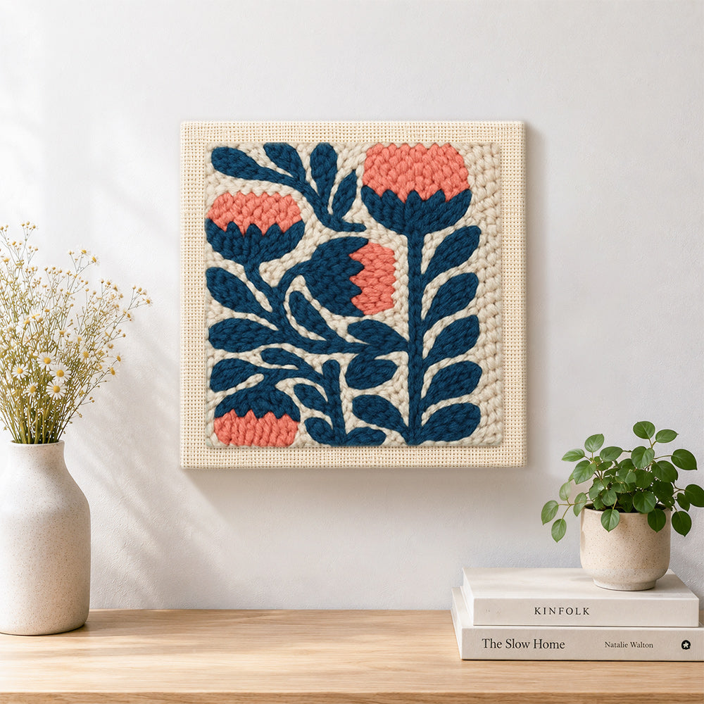 Finished coral and navy flowers artwork displayed on a wall