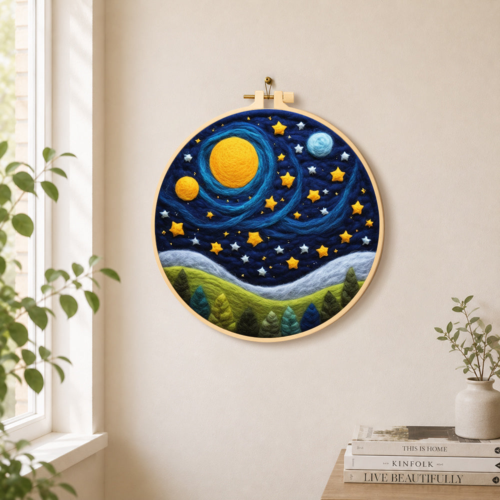 Cosmic planets and starry forest night needle felt wall art displayed in a bright home interior