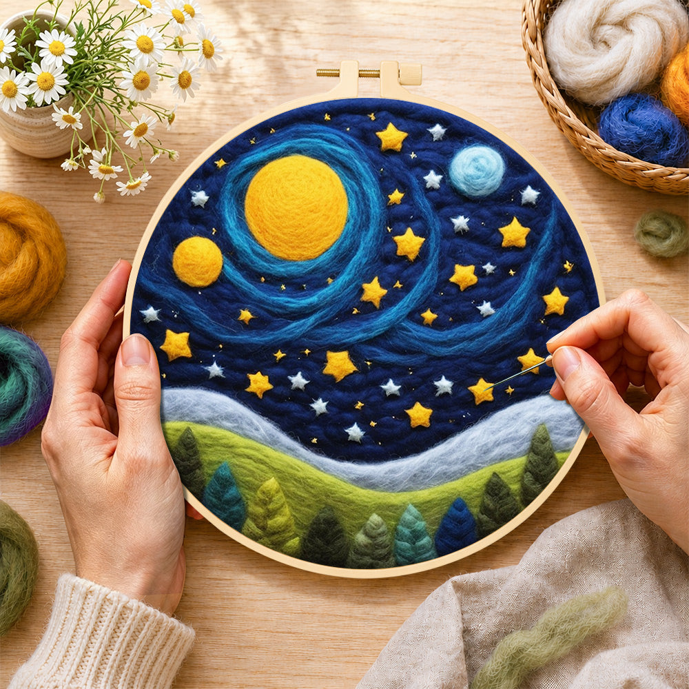 Creating the cosmic planets and starry forest night wool painting by hand with a felting needle