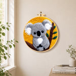 Cosy grey koala needle felt wall art displayed in a bright home interior