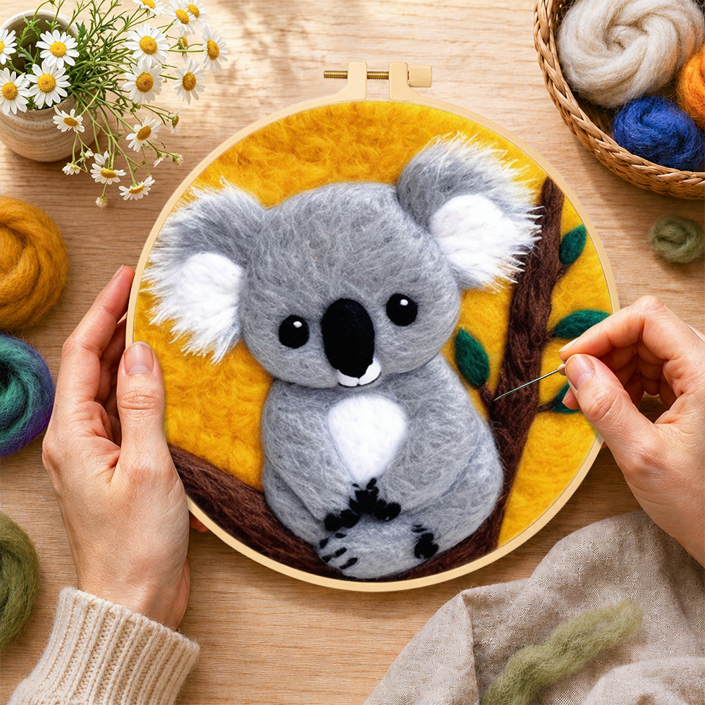 Creating the cosy grey koala wool painting by hand with a felting needle