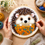 Creating the cosy hedgehog wool painting by hand with a felting needle