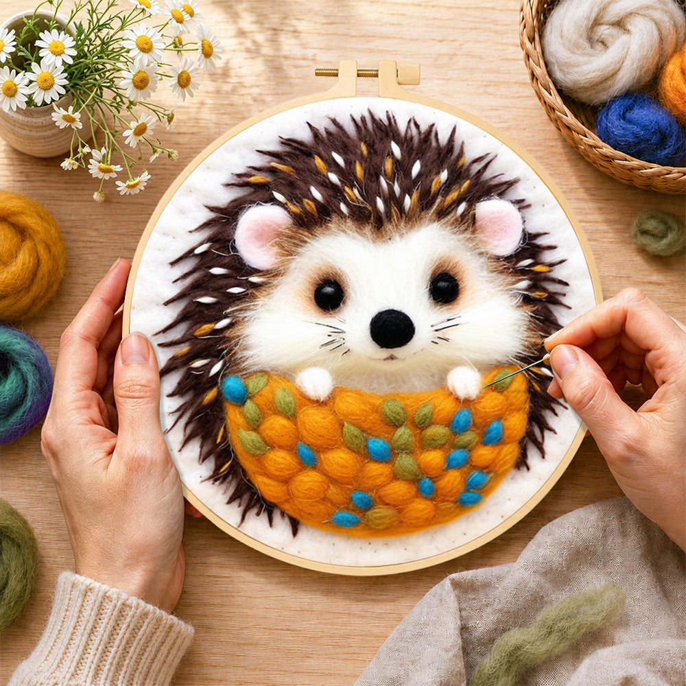 Creating the cosy hedgehog wool painting by hand with a felting needle