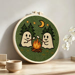 Cosy night camping ghosts punch needle artwork displayed on a table