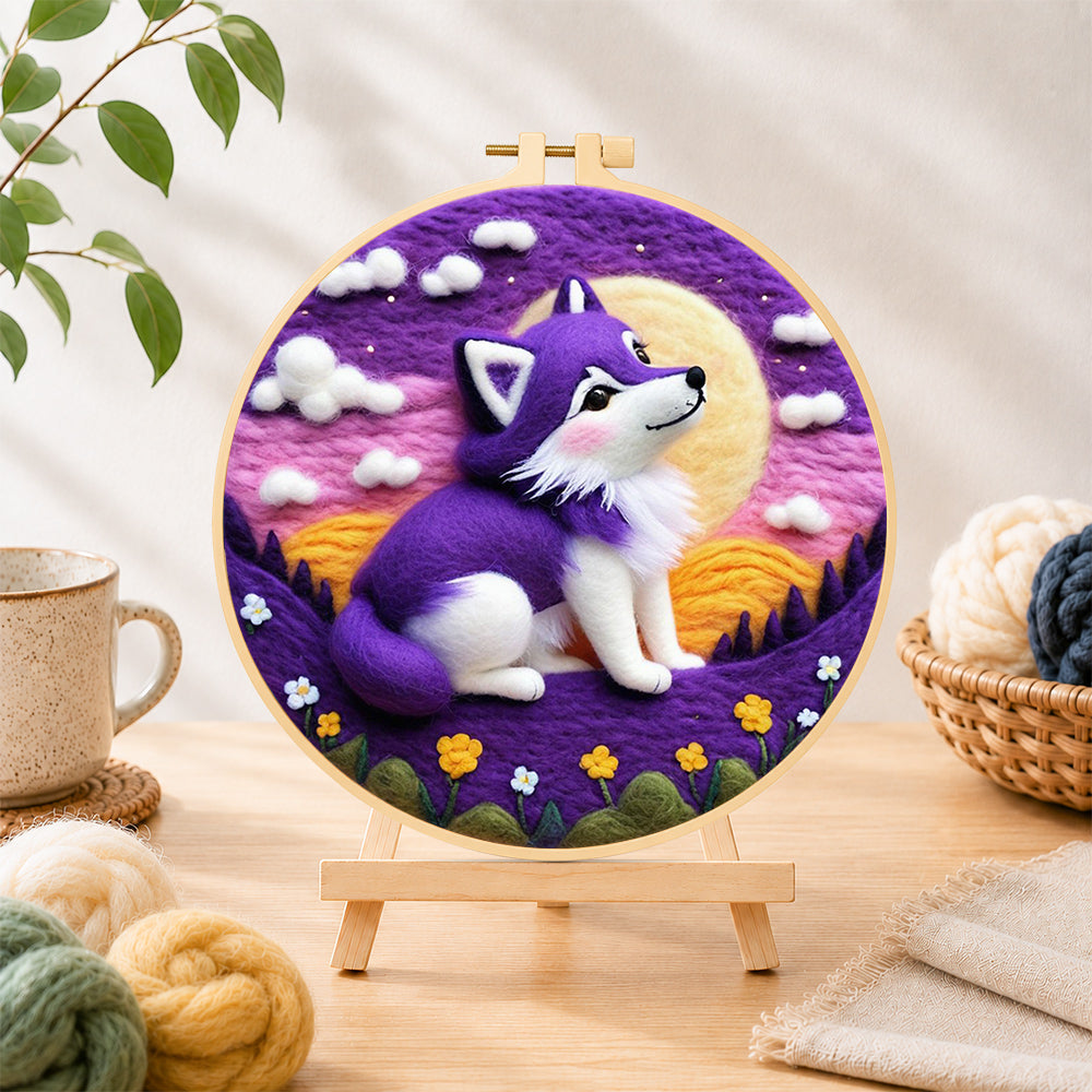 Finished cosy purple wolf under the moon needle felting displayed on a wooden easel