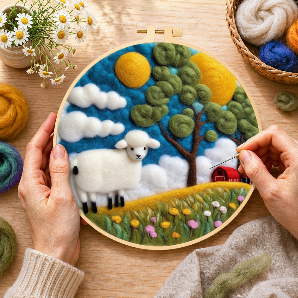 Creating the cosy red barn farm scene with sheep wool painting by hand with a felting needle
