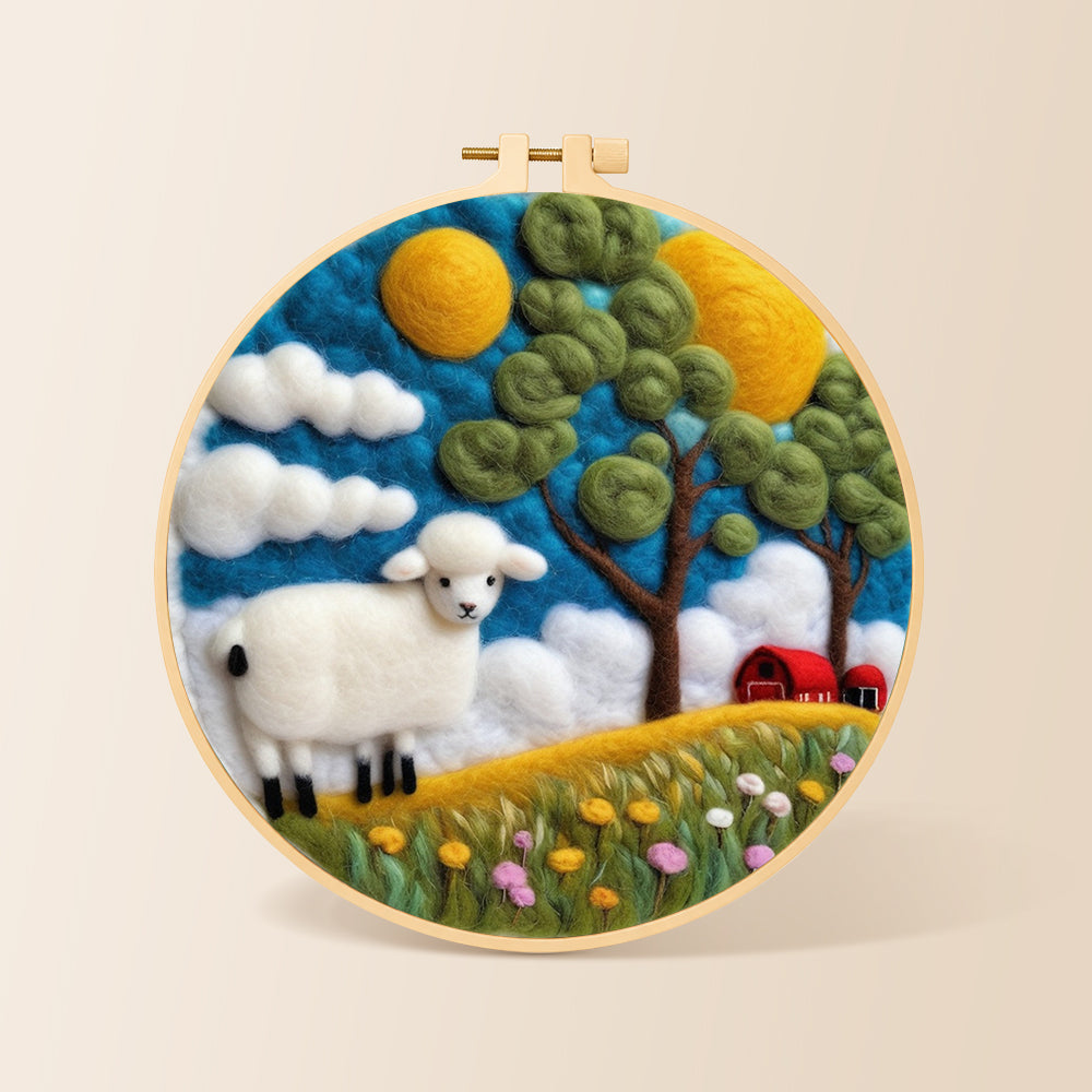 Cosy red barn farm scene with sheep needle felting kit for beginners with a round wooden frame