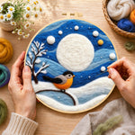 Creating the cosy winter bird under the full moon wool painting by hand with a felting needle