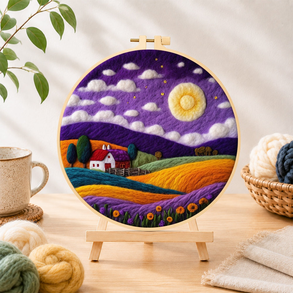 Finished cottage under the mystical purple night needle felting displayed on a wooden easel