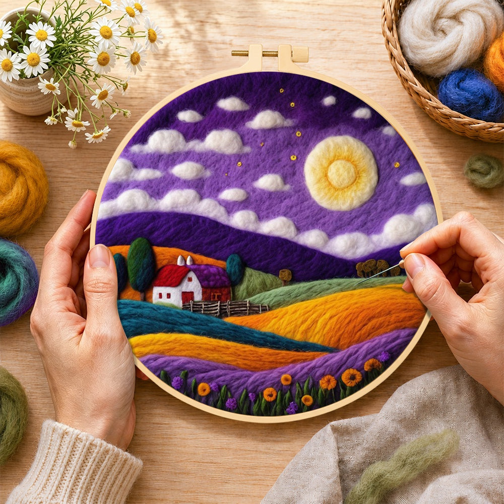 Creating the cottage under the mystical purple night wool painting by hand with a felting needle