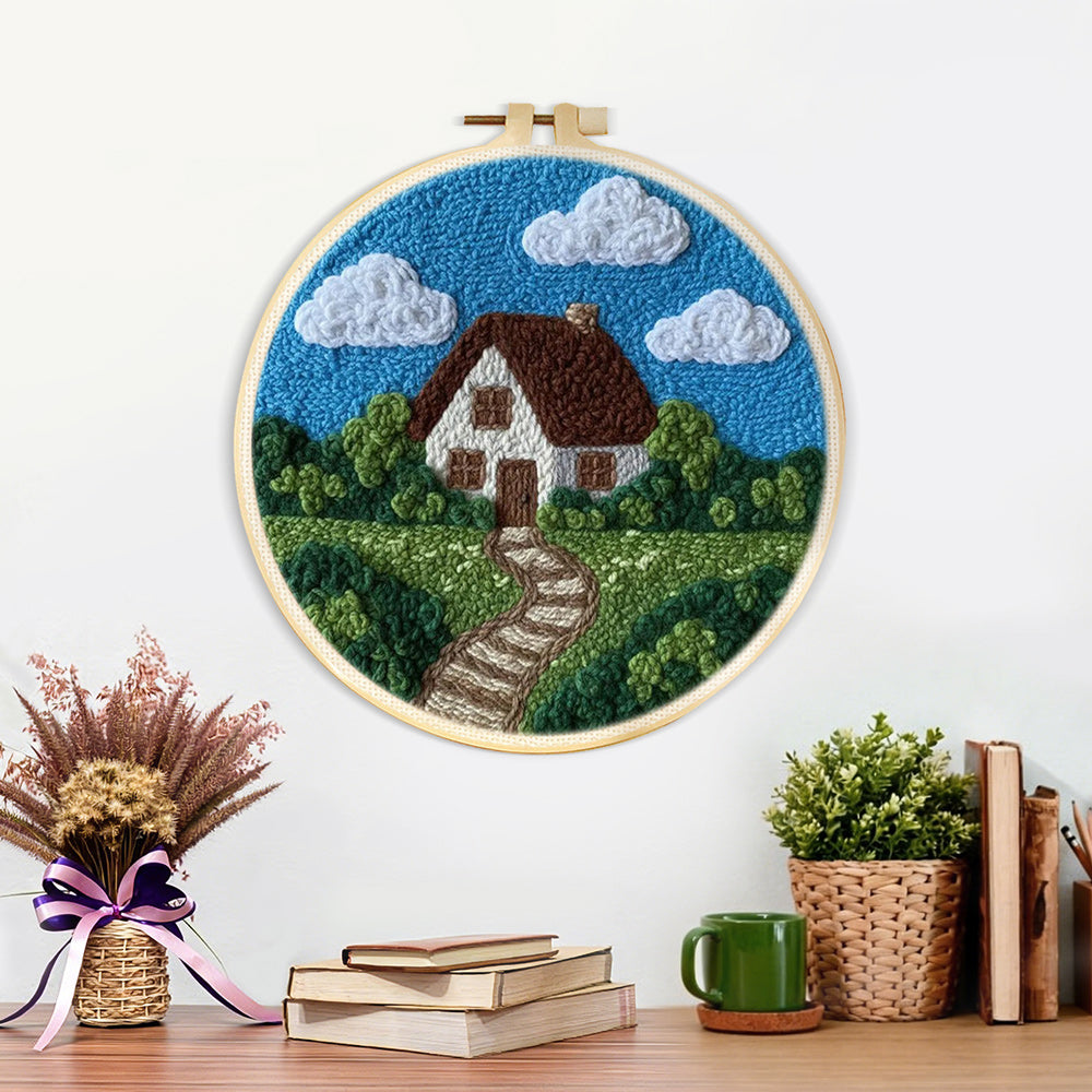Finished countryside cottage with pathway artwork displayed on a wall