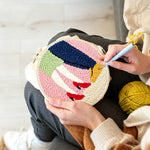 Creating handmade couple embracing punch needle artwork