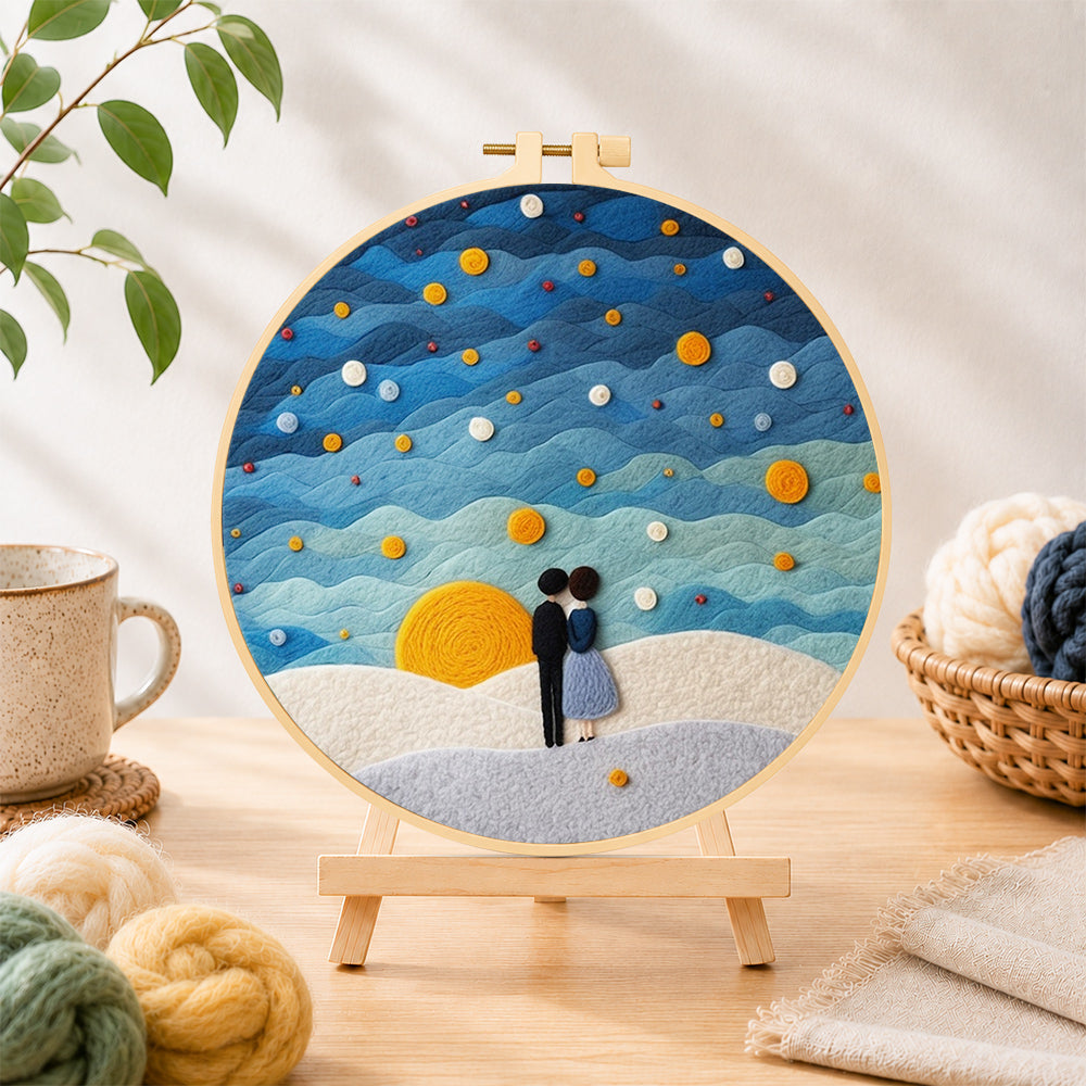 Finished couple under the calming blue starry sky needle felting displayed on a wooden easel