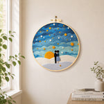 Couple under the calming blue starry sky needle felt wall art displayed in a bright home interior