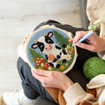 Creating handmade cow in the meadow and flower forest punch needle artwork