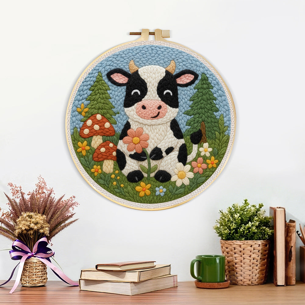 Finished cow in the meadow and flower forest artwork displayed on a wall